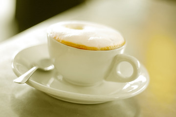 Cup of cappuccino coffee on a table