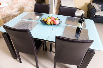 Modern kitchen table with fruits an wine