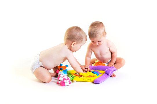 Baby twins playing