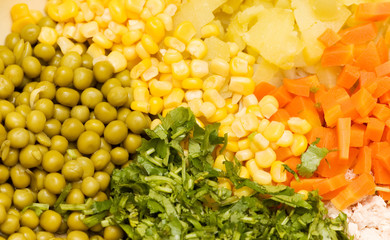 Close up of salad with corn,  carrots, peppers and peas