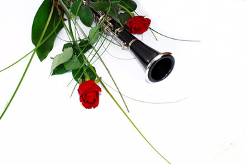 Roses and clarinet composition - obrazy, fototapety, plakaty