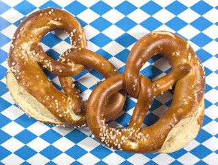 two pretzels on bavarian flag background