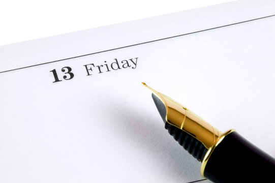 Friday 13th diary page and gold nibbed fountain pen.
