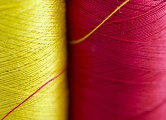 read and yellow thread close up