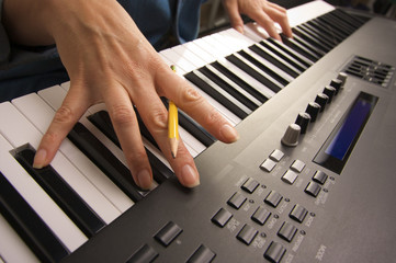 Woman's Fingers on Digital Piano Keys