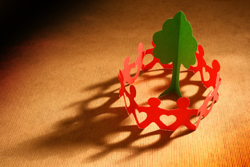 Paper chain people caring for the planet