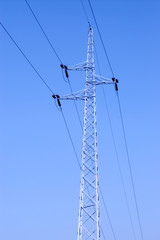 Power line pole on blue sky background