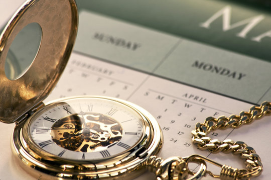 Gold pocket watch and calendar