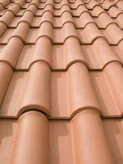 New orange roof tiles close up detail