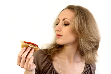 Blonde girl and pancake with caviar