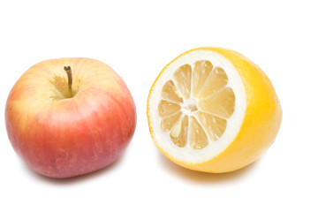 Fototapeta na wymiar apple and lemon on the whie isolated background