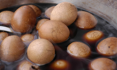 Chinese eggs boiling in black tea