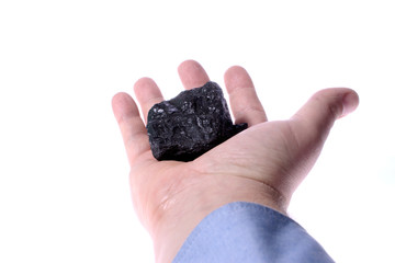 Pieces of coal in palm/ Holding Coal