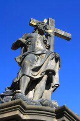 Fototapeta na wymiar Jesus Christ with the Cross-statue on the Charles Bridge
