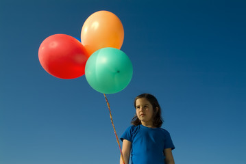 girl and baloons