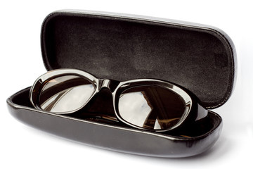 dark sunglasses in vault on white background