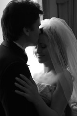 Bride and groom kissing in love