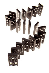 Dominoes standing over white background