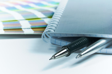 Fototapeta premium blank notebook, pens, color guide