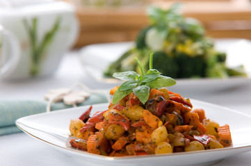 Fresh red vegetable salad with corn and basil