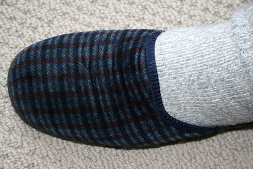 Senior in wool socks and slippers