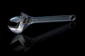 Wrench on a black