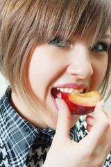 girl bite off nectarine
