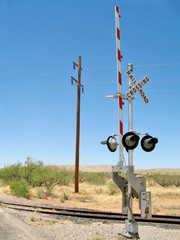 Railroad crossing in desert