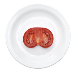 slice of ripe tomato in plate