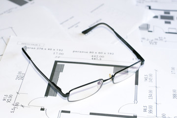 Glasses over blueprints