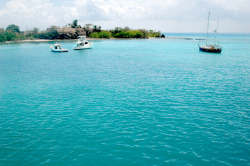 Sailboats in caribbean blue water