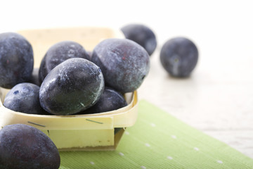plums in small basket