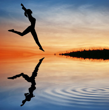 silhouette jump girl on water