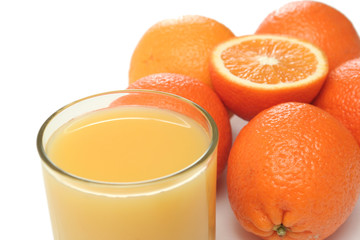 Glass of orange juice and segment of an orange