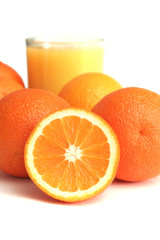 Glass of orange juice and segment of an orange