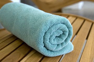 towel braided in a tubule on chair