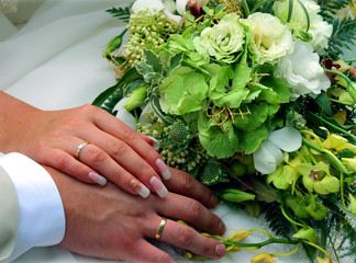 Bride and groom newlyweds holding hands