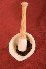 Mortar and Pestle with Black Peppercorns