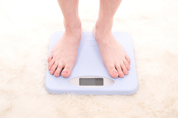 Fototapeta premium Feet on scales