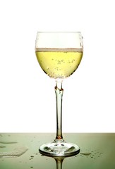 Glass of wine and detail drips of water on table
