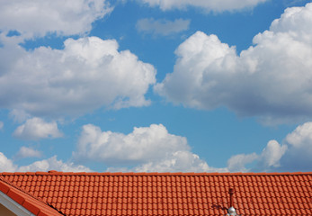 Red Roof and Cloudy Sky
