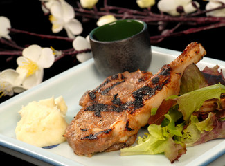Grilled pork chops with mashed potatoes and salad