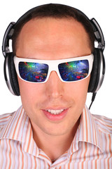 Young man with sunglasses and headphones