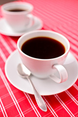 Two coffee cups on a table