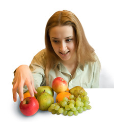 Girl with fruits on white