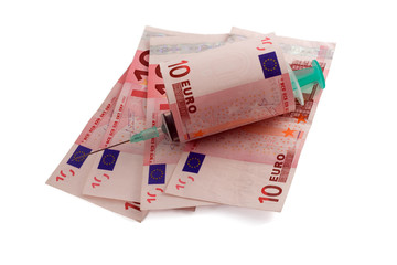 Syringe with needle on euro money
