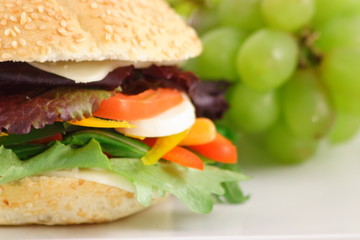 veggies sandwich  and grapes dessert