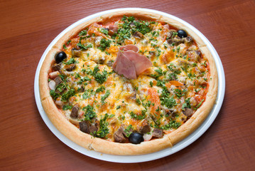 Tasty Italian pizza with ham