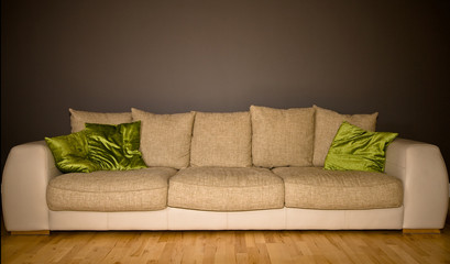 Large comfortable couch against a dark grey background
