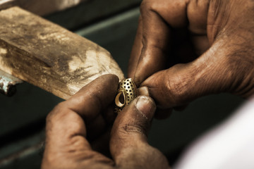 Goldsmith and earring.